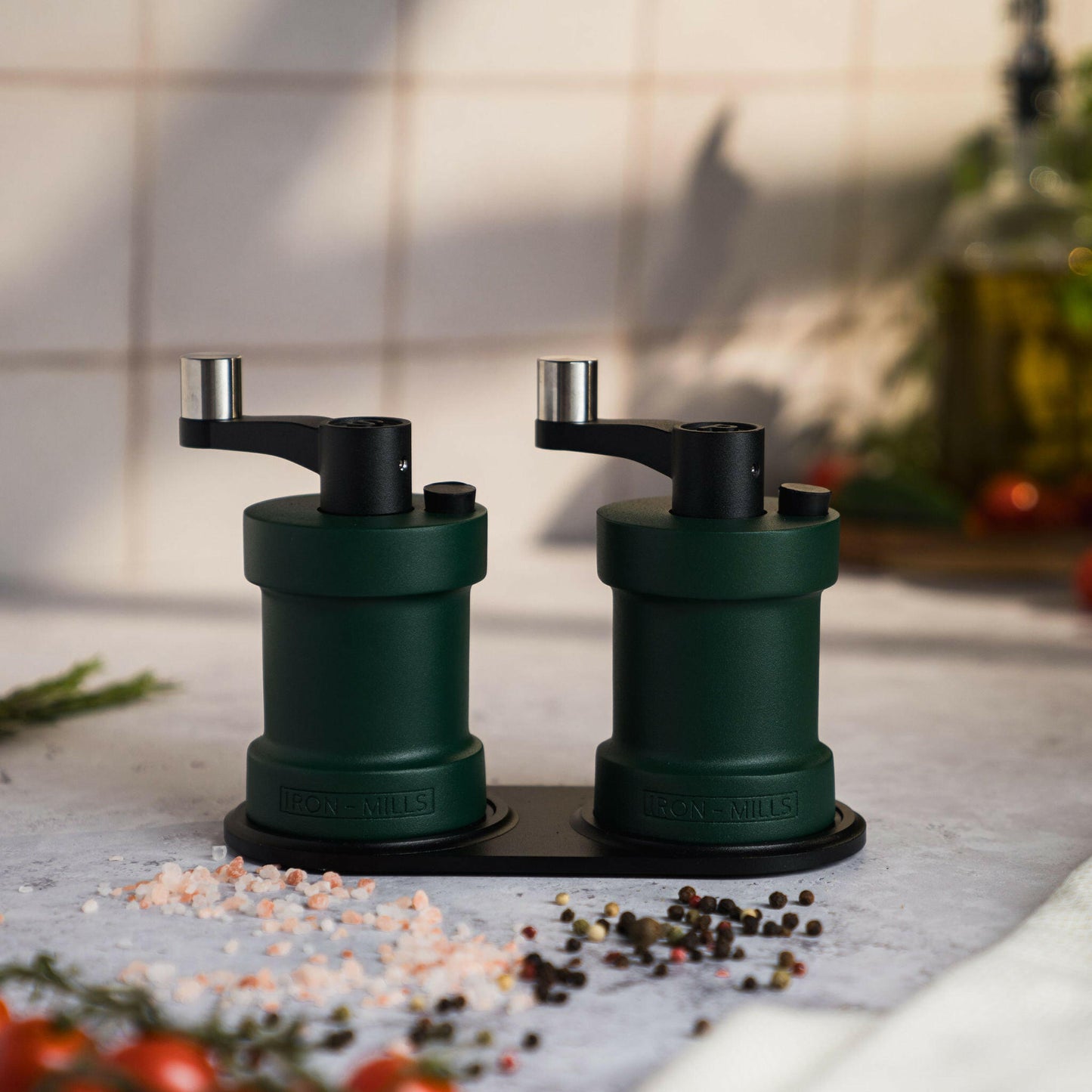 Iron-Mills ivy green salt and pepper mills resting together to highlight their classic colour pairing